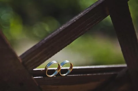 Gold wedding rings on the window  Stock Photos
