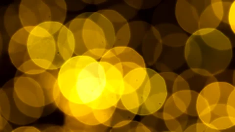 Golden abstract defocused background, circle shape bokeh spots. Loop. Stock Footage 259949368