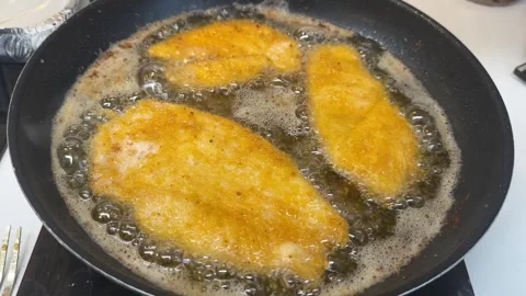 Golden and crispy breaded schnitzels Stock Footage 295504561
