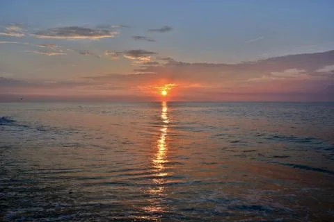 Golden and Glowing Summer Seashore Sunrise Stock Photos