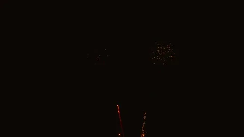 Golden and orange fireworks exploding at night Video stock 343160316