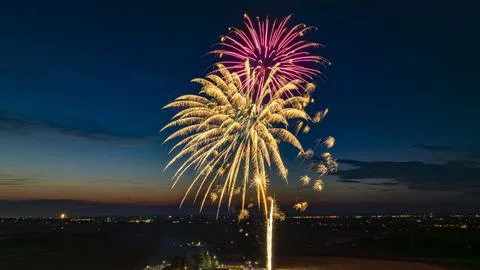 Golden And Pink Fireworks Exploding In The Night Sky, Creating Brilliant Bu.. Stock Photos