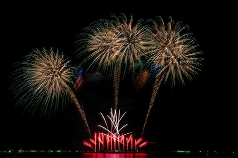 Golden And Red Fireworks Exploding In Night Sky During Festive Celebration .. Stock Photos