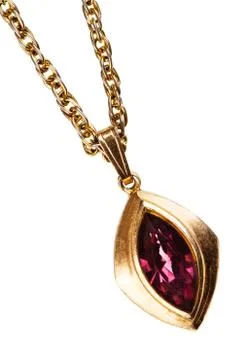 Golden and ruby pendant on chain 库存照片