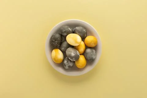 Golden and silver easter eggs in straw nest Stock Photos