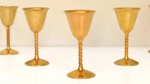 Golden antique goblets on the white table Vídeos de archivo 278783745