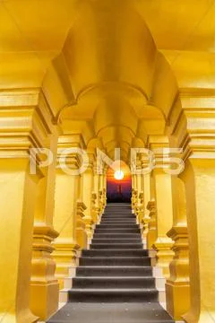 Golden arch over the stair and sunrise background Stock Photos