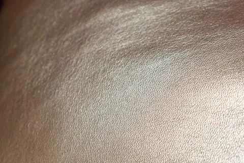 Golden background of an authentic image of an object, zoom on its texture f.. 库存照片