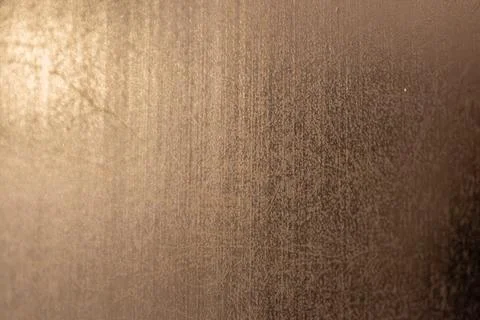 Golden background of an authentic image of an object, zoom on its texture f.. 스톡 사진