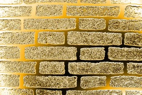 Golden background based on the image of a brick wall tinted in gold Stock Illustration