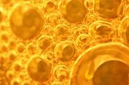 Golden Background With Big And Small Gold Bubbles Oil Inside A Gold Liquid Stock Photos
