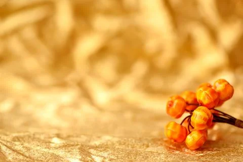 Golden background fall in abstract style with orange pumpkin decoration. Stock Photos