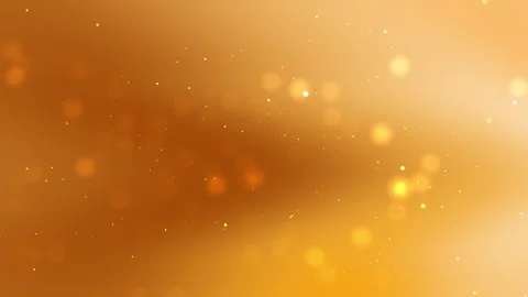 Golden background features scattered bright lights and tiny sparkles. Stock Footage 302140612