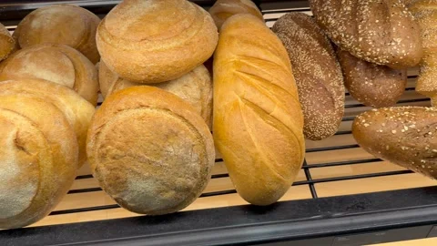 Golden baked bread rolls arranged on oven tray display fresh artisan bakery Stock-Footage 334319946
