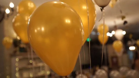 Golden ballons on the ceiling at the party Stock Footage 90717774