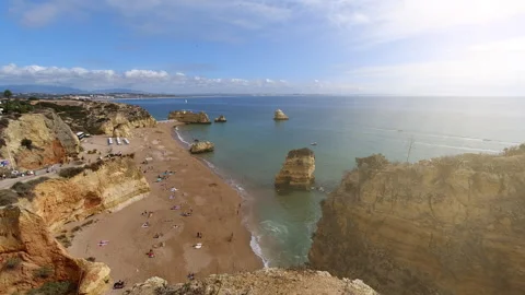 Golden Beach Paradise with Dramatic Cliffs in Portugal Perfect for Summer V.. Stock Footage 311107357