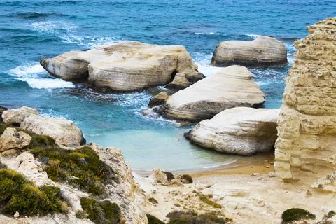 Golden beach with rocks background, Cliffs in the sea, Top aerial view Stock Photos
