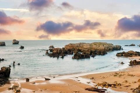 Golden beach at sunset Ris, Noja, Cantabria, Spain Stock Photos