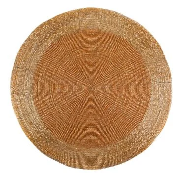 Golden beadwork table mat with round lines pattern Foto stock