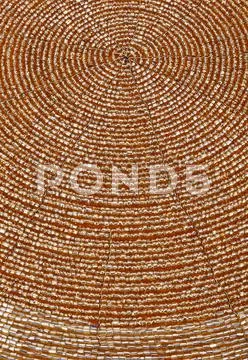 Golden beadwork texture background with round lines pattern Stock Photos