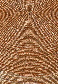 Golden beadwork texture background with round lines pattern Stock Photos
