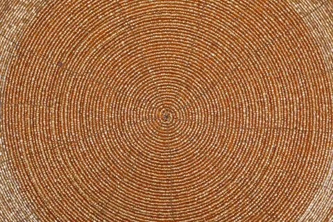 Golden beadwork texture background with round lines pattern Stock Photos