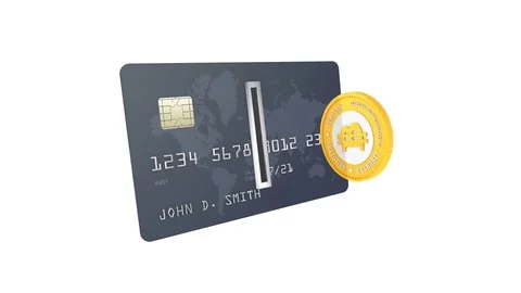 Golden Bitcoin being inserted into coin acceptor on a credit card. Seamless loop Stock Footage 75949279