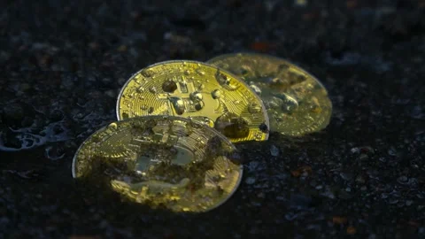 Golden Bitcoin Coins Sinking in Mud during Rain, Slow Motion Rainfall Stock Footage 339809702