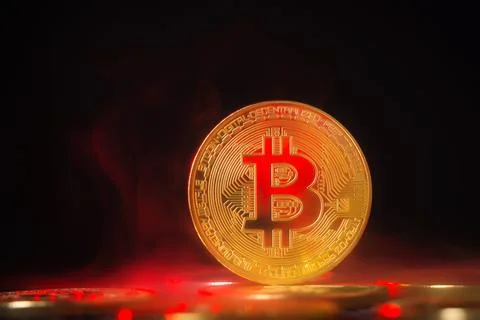 Golden Bitcoin Cryptocurrency Coin with Red Lighting on Dark Background Stock Photos