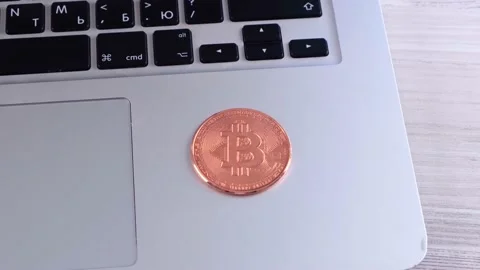 Golden Bitcoin cryptocurrency coin stack on laptop keyboard, Crypto is Digital Stock Footage 157762270