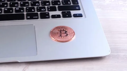 Golden Bitcoin cryptocurrency coin stack on laptop keyboard, Crypto is Digital Stock Footage 157969253