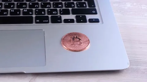 Golden Bitcoin cryptocurrency coin stack on laptop keyboard, Crypto is Digital Stock Footage 158448865