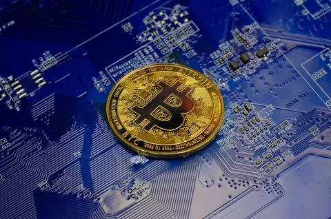 Golden bitcoin cryptocurrency new version on computer electronic circuit bo.. Stock Photos