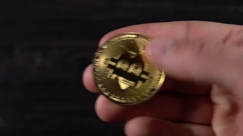Golden bitcoin in the hands Stock Footage 87210757