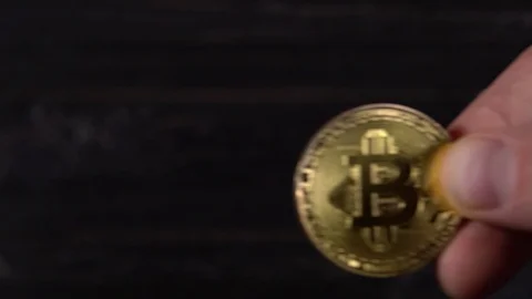 Golden bitcoin in the hands Stock Footage 87210954