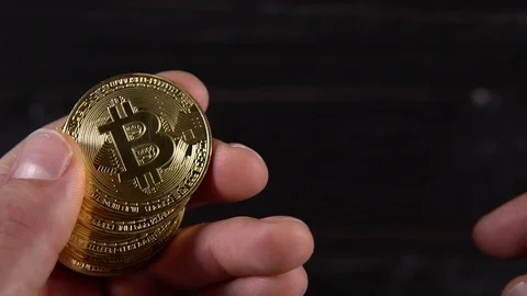 Golden bitcoin in the hands Stock Footage 87212039