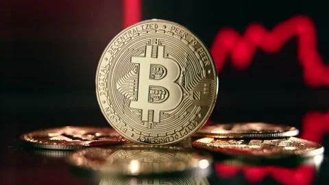 Golden bitcoin isolated on digital chart with red line representing global Stock Footage 234335666