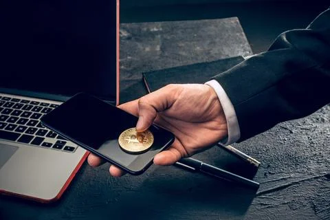 The golden bitcoin in mail hands Stock Photos