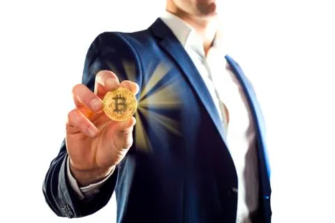 Golden Bitcoin in a man hand, Digitall symbol of a new virtual currency 스톡 사진