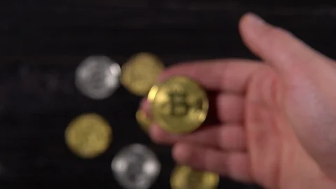 Golden bitcoin in a man's hand. Stock Footage 87215880