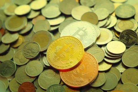 Golden bitcoin over a stack on thai coins, Litecoin cryptocurrency, dream for Stock Photos