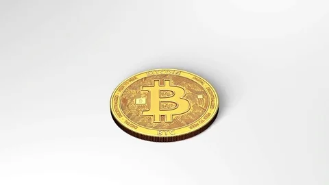 Golden Bitcoin is spinning until it stops and falls. Close up. 스톡 동영상 78675905