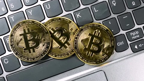 Golden Bitcoins on Computer Keyboard Stock Footage 336374221