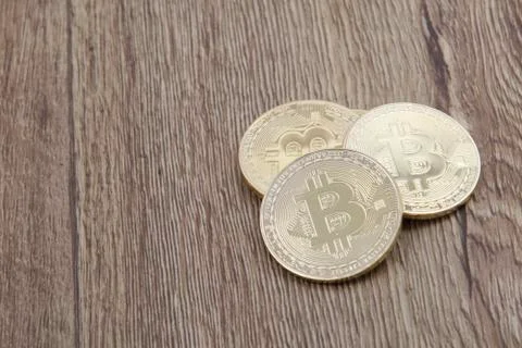 Golden Bitcoins on a table 스톡 사진