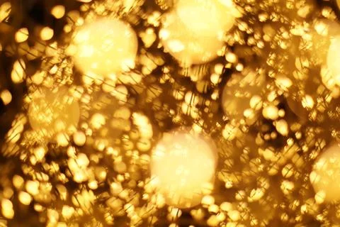 The golden bokeh blurred abstract pattern background. Stock Photos