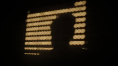 Golden bokeh light circles forming an abstract pattern against a dark Stock Footage 343537888