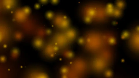 Golden bokeh light particles floating on a dark background, warm and luxurious Stock Footage 330581484