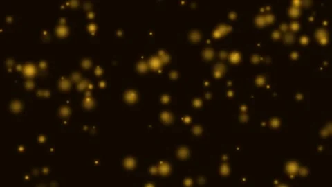 Golden bokeh light particles floating softly against a deep black background Vídeos de archivo 335145856