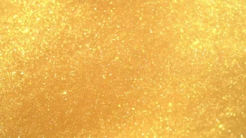 Golden bokeh light particles shimmering on abstract background. Glowing defocuse Stock-Footage 340456684