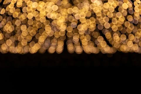 Golden Bokeh Light Pattern on a Dark Background for Elegant Atmosphere Stock Photos